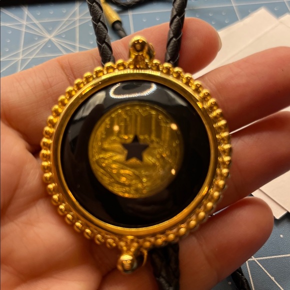 Black and Gold Bolo Tie with Circular Pendant with Star Center Black Braided - Picture 8 of 16